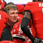 Georgia-football-head-coach-Kirby-Smart-in-a-huddle-with-his-players